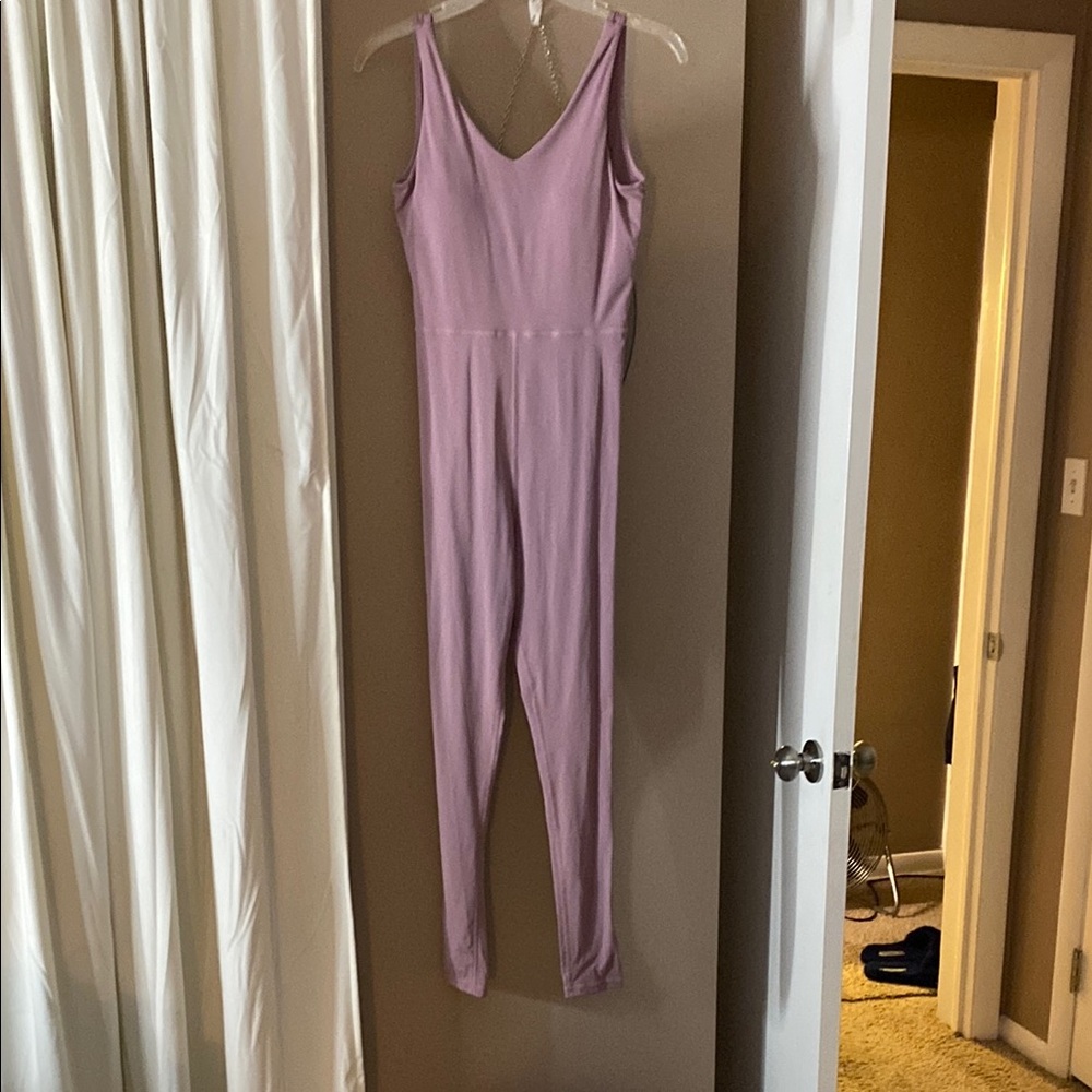 Purple Skinny Jumpsuit with V-neckline and Fitted Silhouette - Never Worn